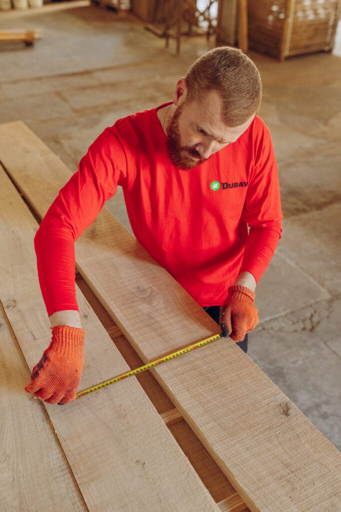 A man works in wood processing company in Dubava, Ukraine