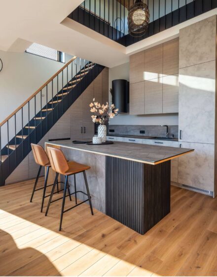 Nature inspired Coastal Interior Featuring Oak Wood Flooring, Earthy Colour Pallete and Captivating Forest Views